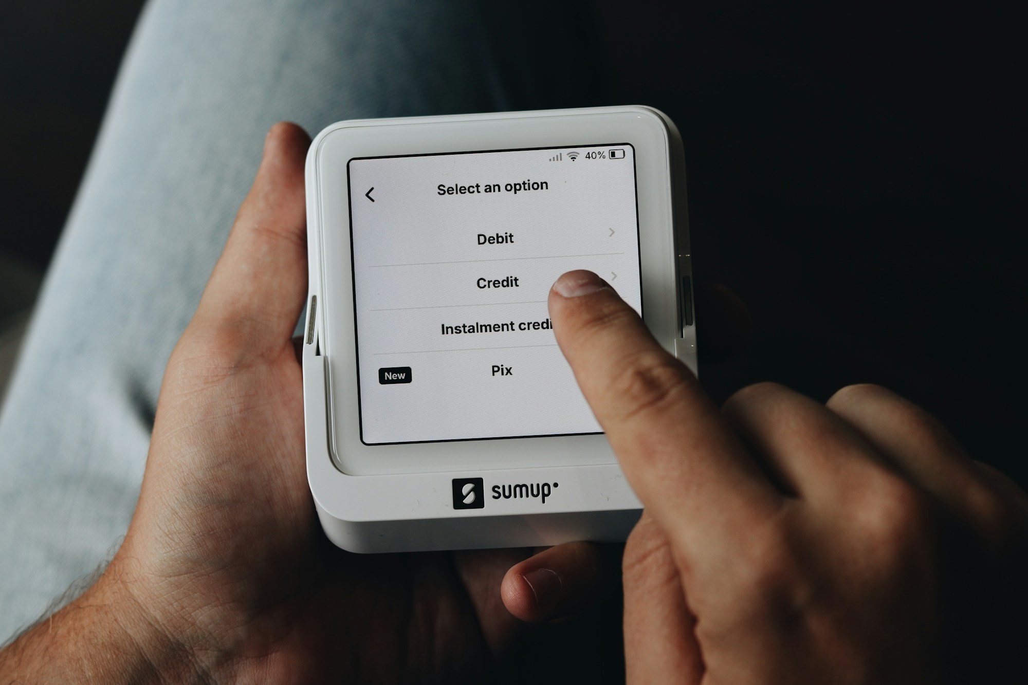 A customer selecting a payment option on a digital card terminal